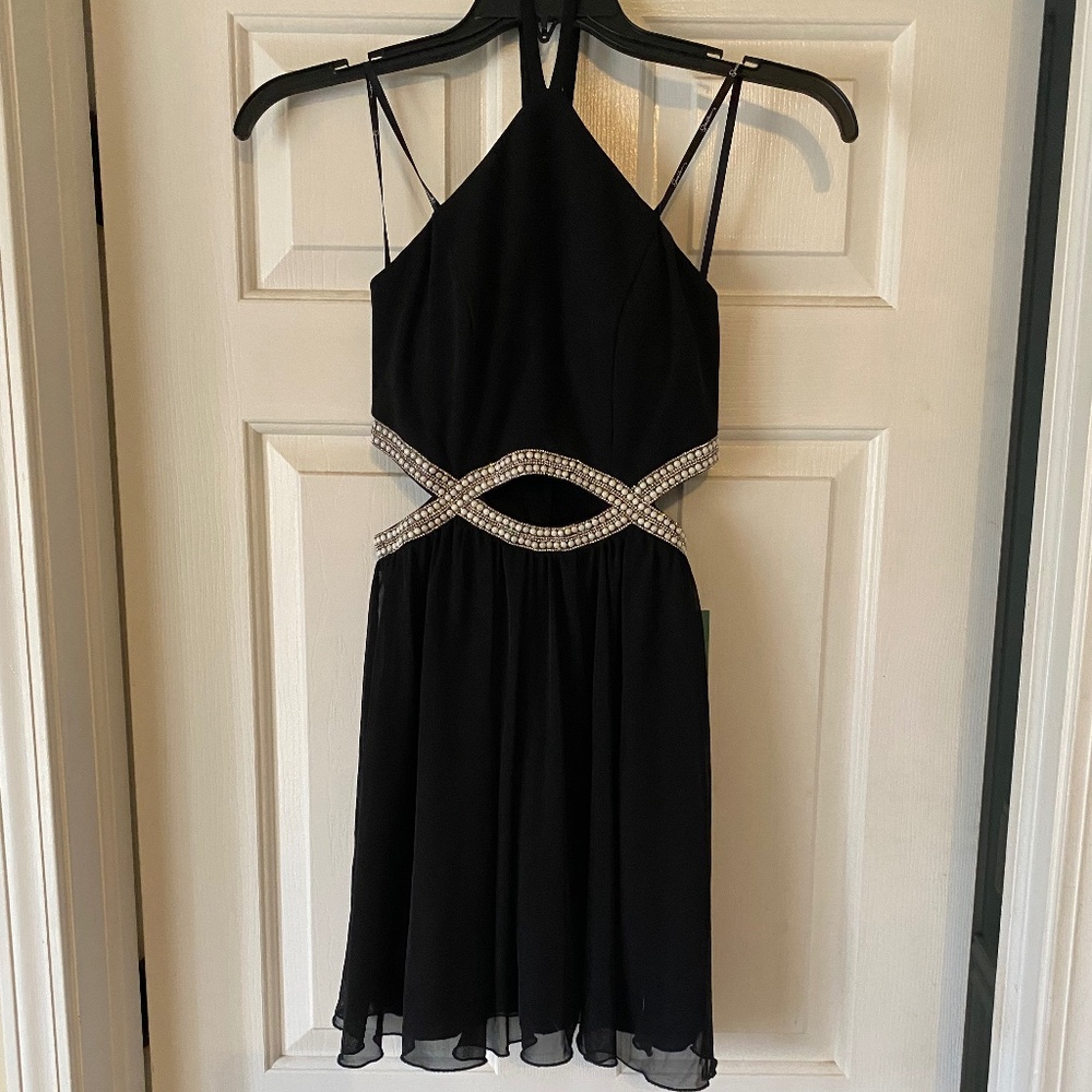 Black cocktail dress with side cutouts NWT